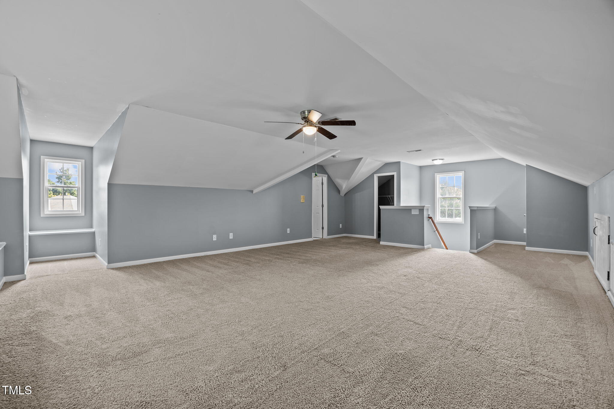 2310 Shepherd Valley Street Raleigh, NC 27610 - Photo 13 of 27 a view of a big room with closet and windows