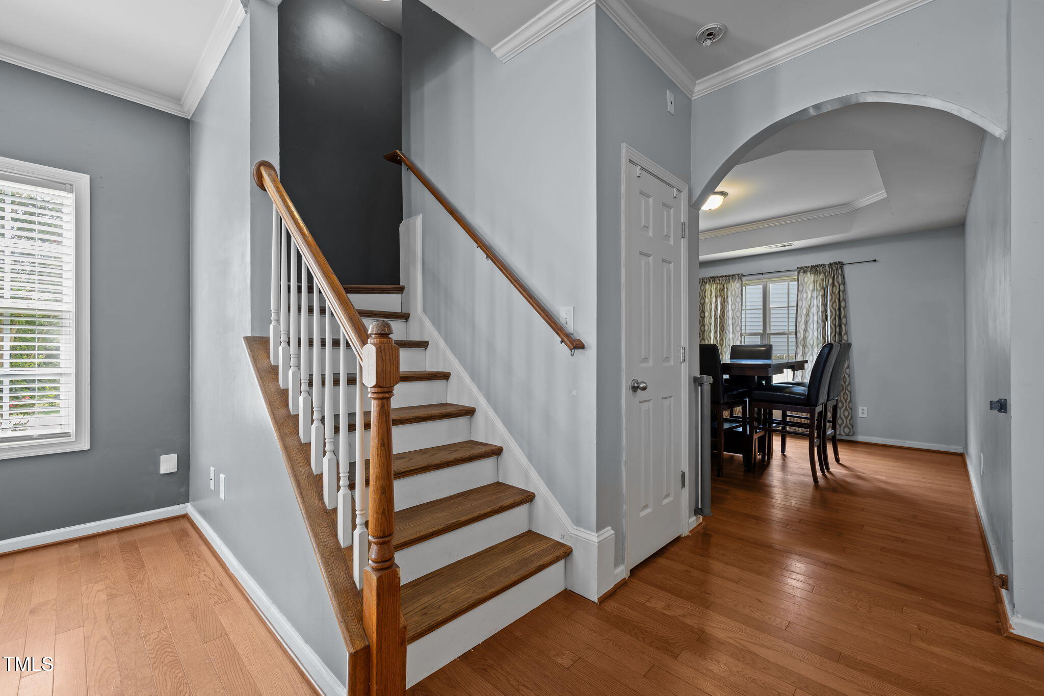 2310 Shepherd Valley Street Raleigh, NC 27610 - Photo 4 of 27 a view of entryway and dining room with wooden floor