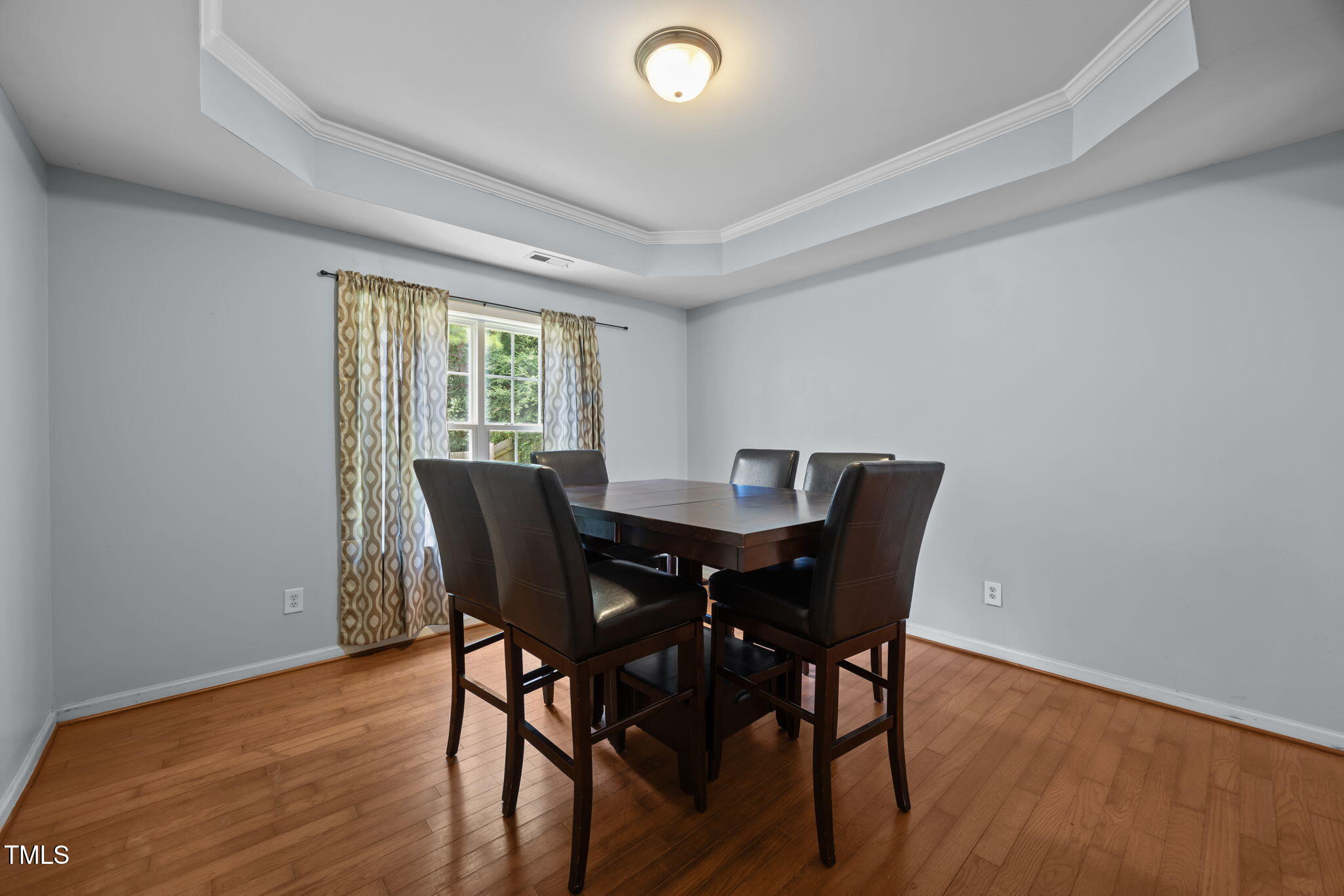 2310 Shepherd Valley Street Raleigh, NC 27610 - Photo 5 of 27 a view of a dining room with furniture window and wooden floor