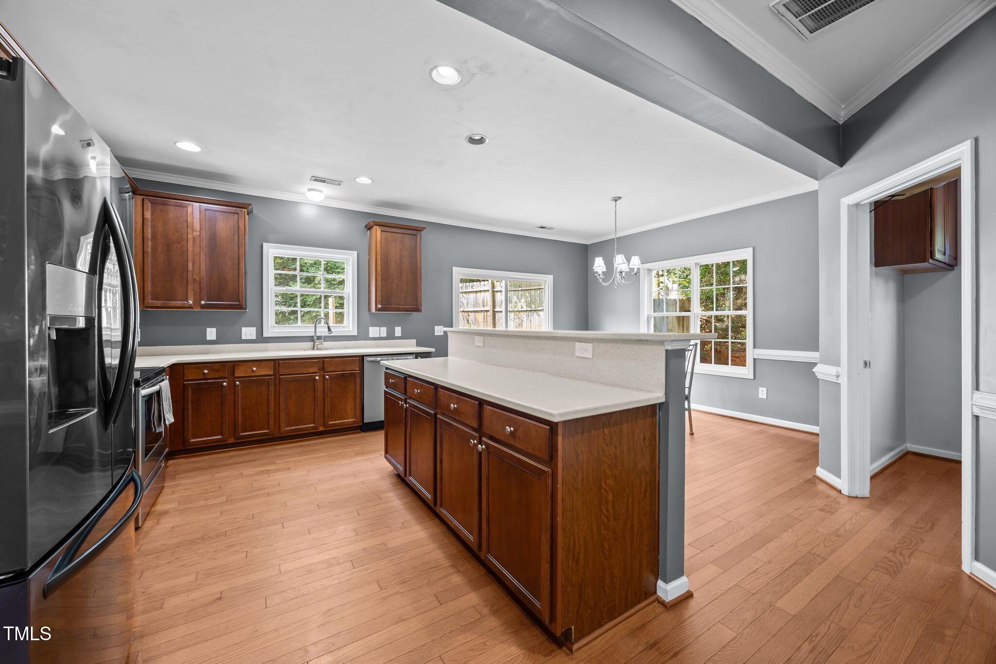2310 Shepherd Valley Street Raleigh, NC 27610 - Photo 6 of 27 a kitchen with stainless steel appliances granite countertop wooden cabinets a sink a stove a refrigerator and a sink