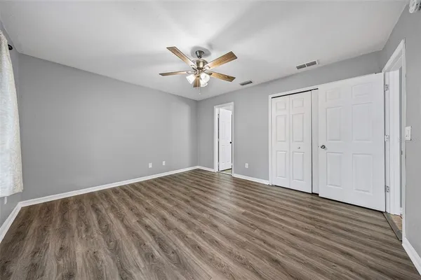 a view of an empty room and wooden floor