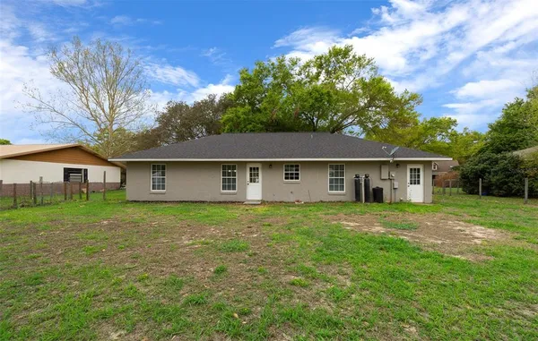 a view of a house with a big yard