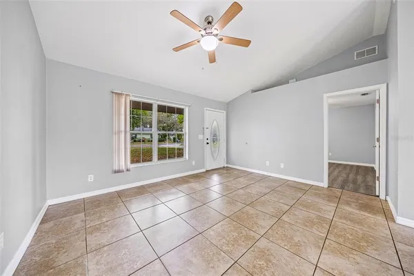 a view of an empty room with a window
