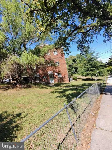 a view of swimming pool with a yard