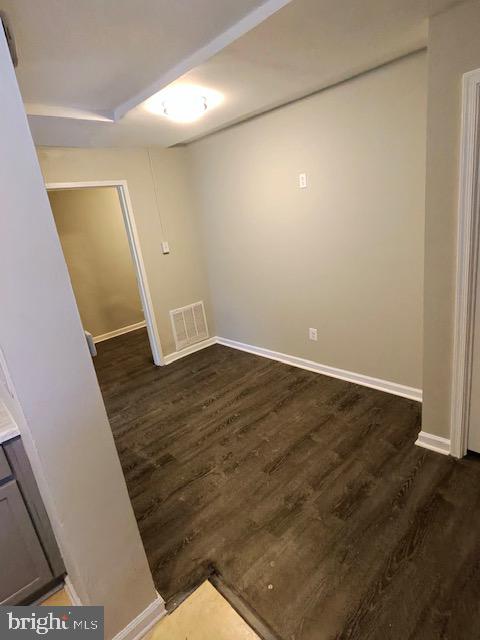 4778 South Capitol Terrace Southwest, Unit C Washington, DC 20032 - Photo 10 of 12 a view of an empty room with wooden floor