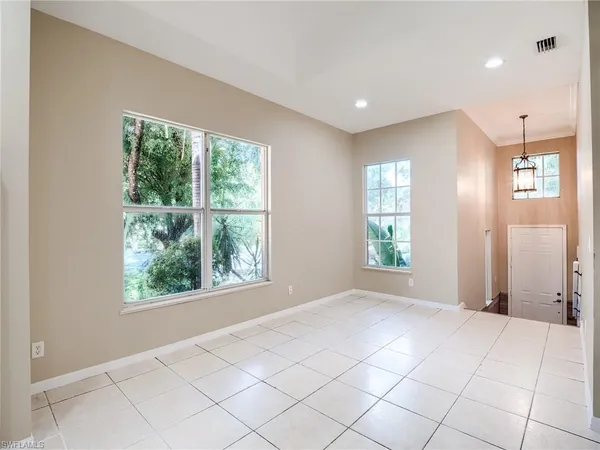 a view of kitchen with furniture and large window
