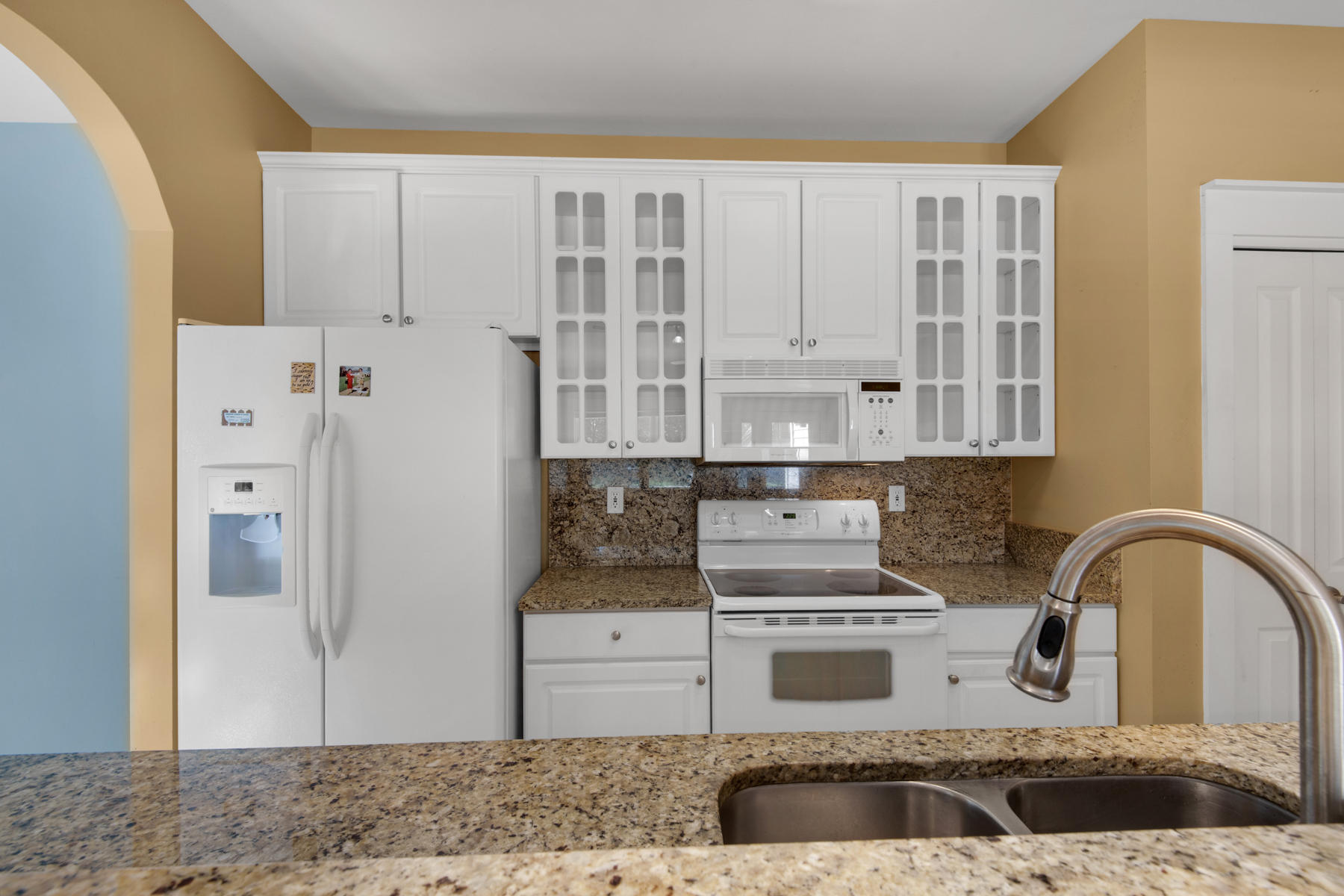 74 Garden Street Santa Rosa Beach, FL 32459 - Photo 16 of 43 a kitchen with granite countertop a stove and a granite counter tops