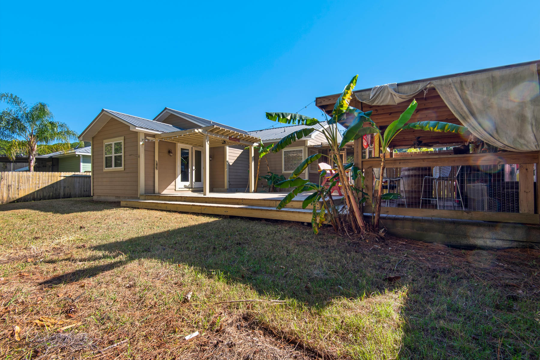 74 Garden Street Santa Rosa Beach, FL 32459 - Photo 32 of 43 a front view of a house with a yard