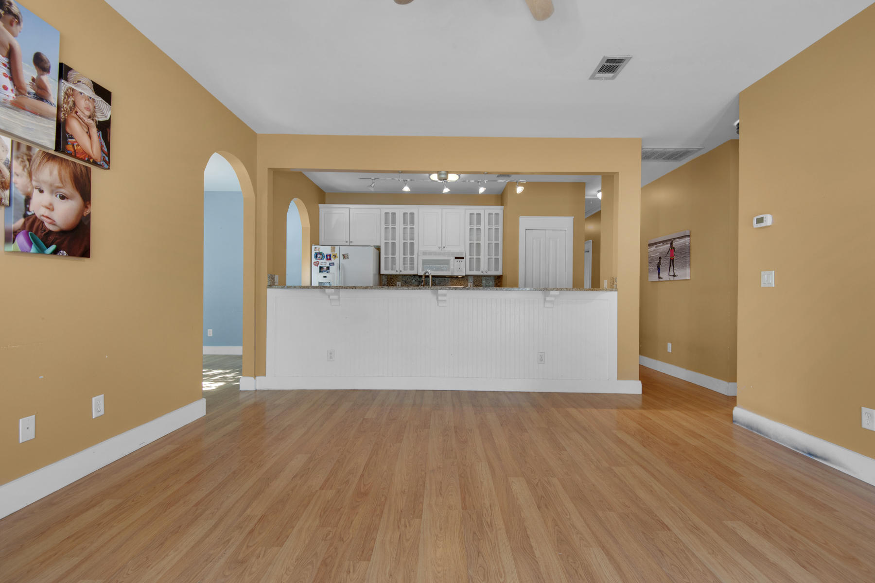 74 Garden Street Santa Rosa Beach, FL 32459 - Photo 5 of 43 a view of a kitchen with wooden floor and a window