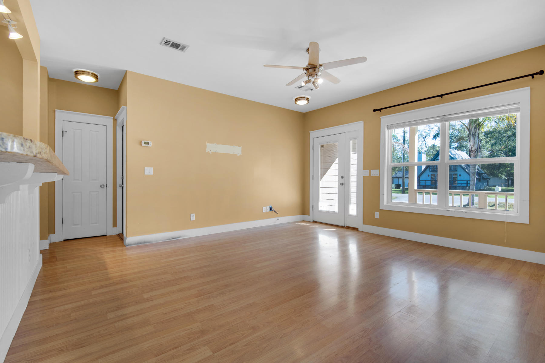 74 Garden Street Santa Rosa Beach, FL 32459 - Photo 6 of 43 a view of an empty room with a window and wooden floor