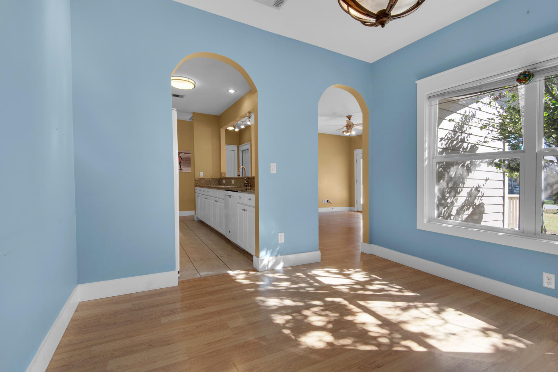 74 Garden Street Santa Rosa Beach, FL 32459 - Photo 8 of 43 an empty room with windows and wooden floor
