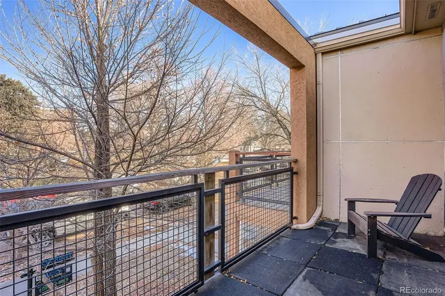 a view of balcony with furniture