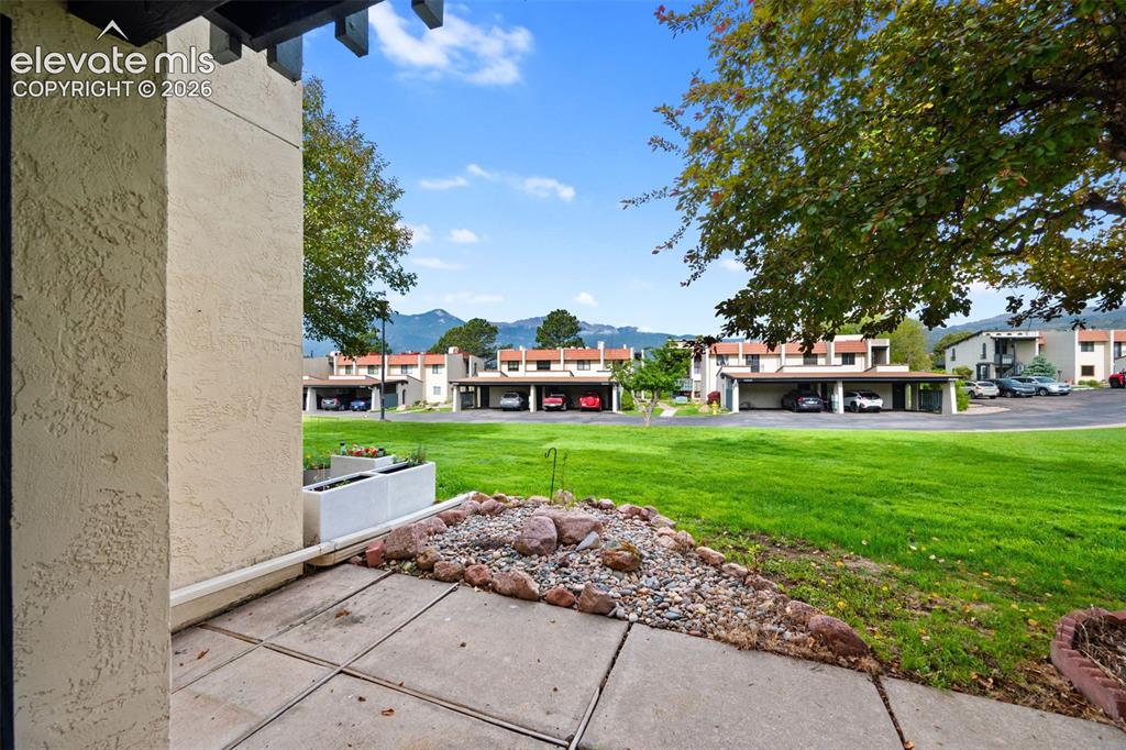 1018 Fontmore Road, Unit A Colorado Springs, CO 80904 - Photo 20 of 28 a front view of a house with garden