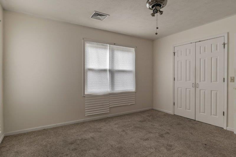 405 Meridian Drive Springfield, IL 62702 - Photo 18 of 26 an empty room with a empty space and windows