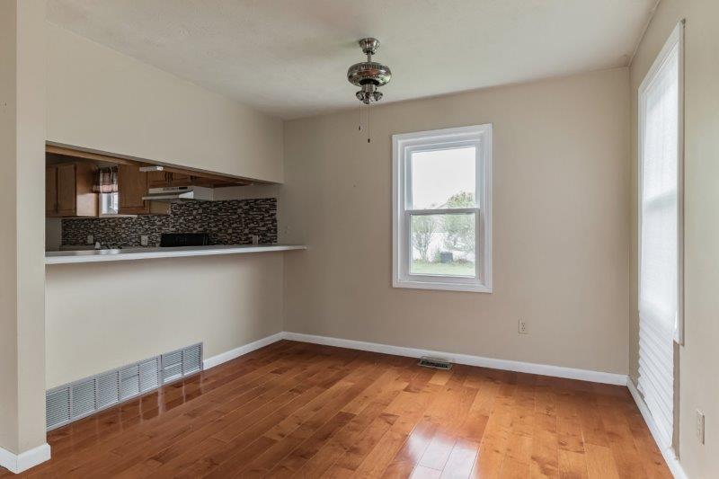 405 Meridian Drive Springfield, IL 62702 - Photo 8 of 26 a view of empty room with wooden floor and fan