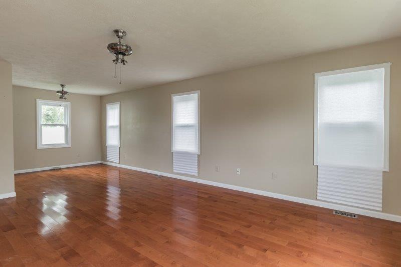 405 Meridian Drive Springfield, IL 62702 - Photo 10 of 26 wooden floor in an empty room with a window