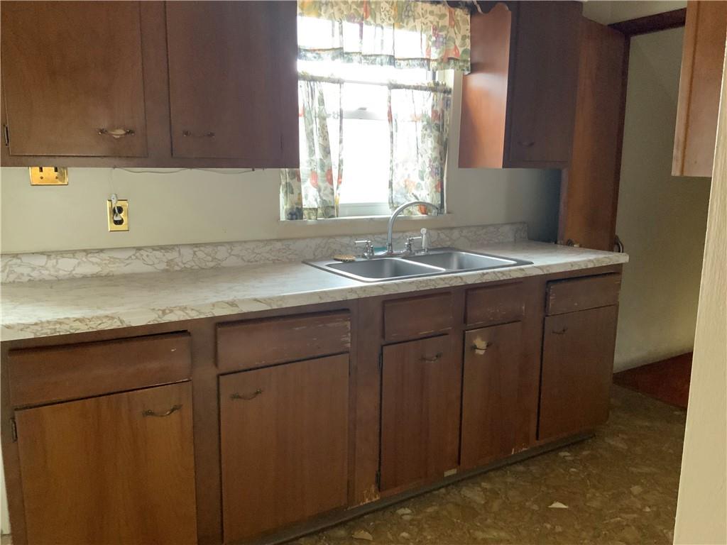 1178 Amity Ridge Road Amity, PA 15311 - Photo 2 of 15 a view of a kitchen with a sink window and cabinets