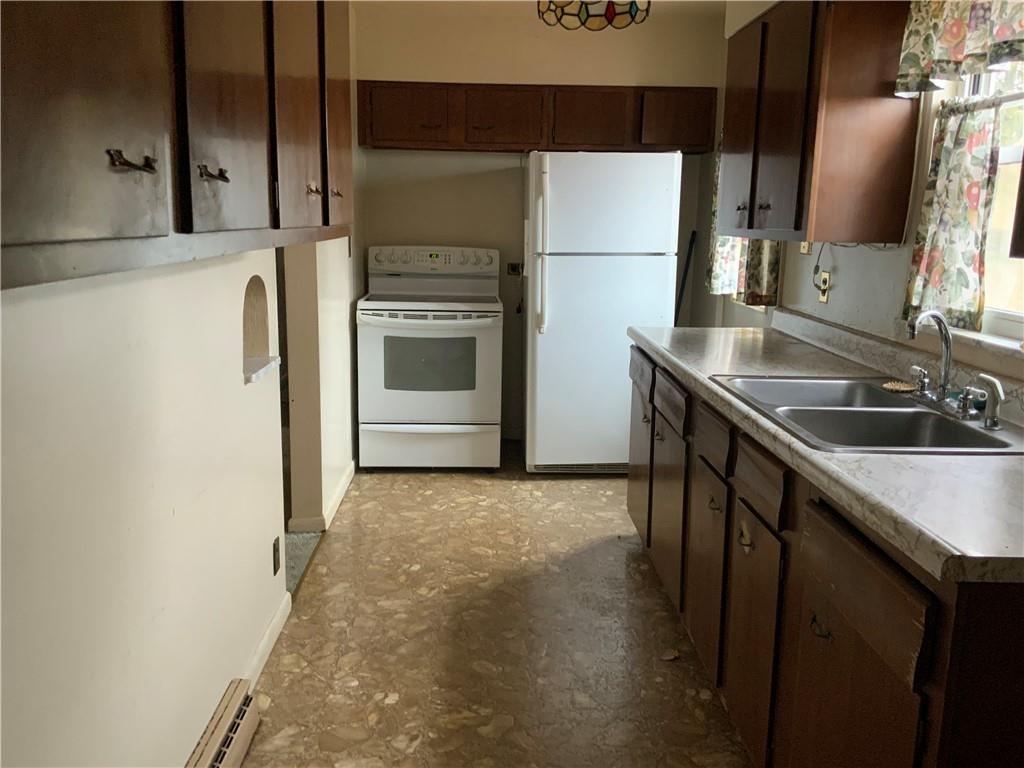 1178 Amity Ridge Road Amity, PA 15311 - Photo 3 of 15 a kitchen with a sink stove and refrigerator