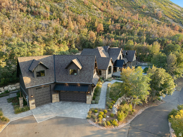 1141 South Oak Leaf Lane Springville, UT 84663 - Photo 130 of 147 Multi-gabled residence featuring stone and vertical siding, a paved driveway, and multiple garage doors