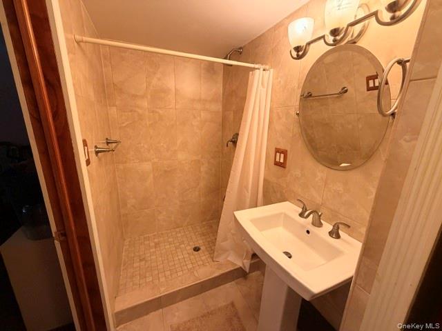 150-06 78th Road Queens, NY 11367 - Photo 21 of 22 a bathroom with a sink vanity and shower