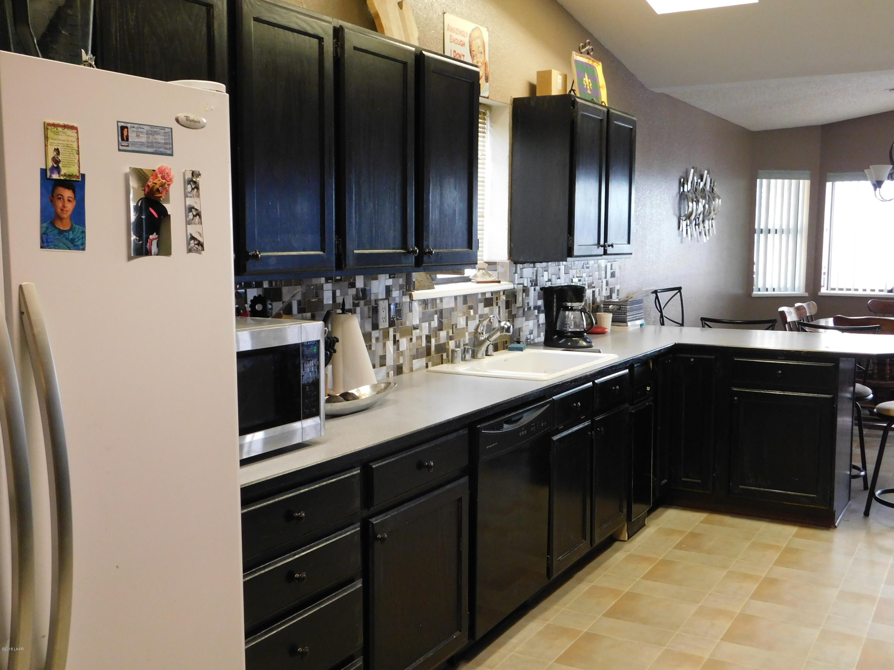 4010 Bluegrass Drive, Unit R Lake Havasu City, AZ 86406 - Photo 11 of 47 a kitchen with a sink and cabinets