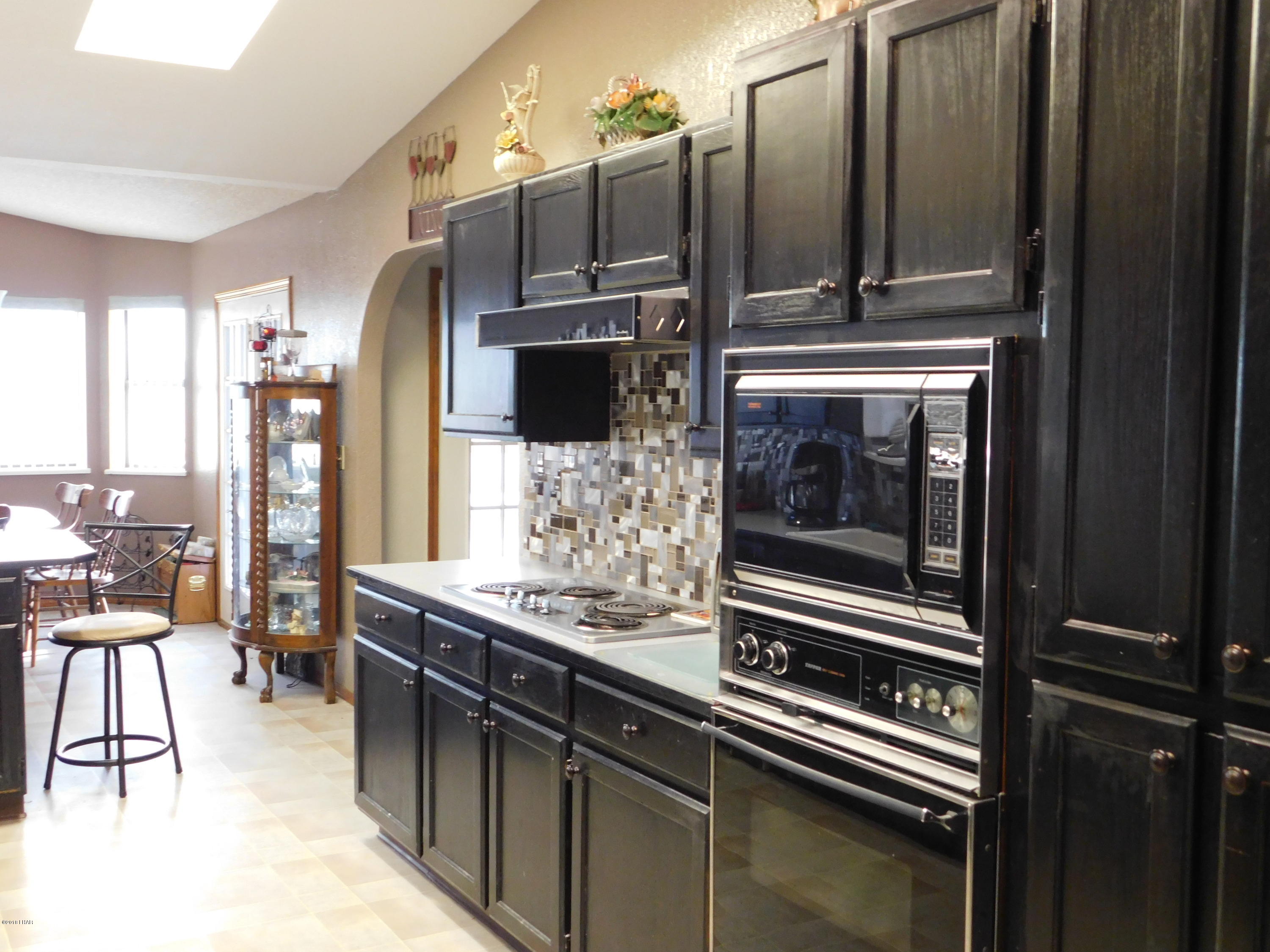 4010 Bluegrass Drive, Unit R Lake Havasu City, AZ 86406 - Photo 13 of 47 a kitchen with stainless steel appliances kitchen island granite countertop a refrigerator and a stove