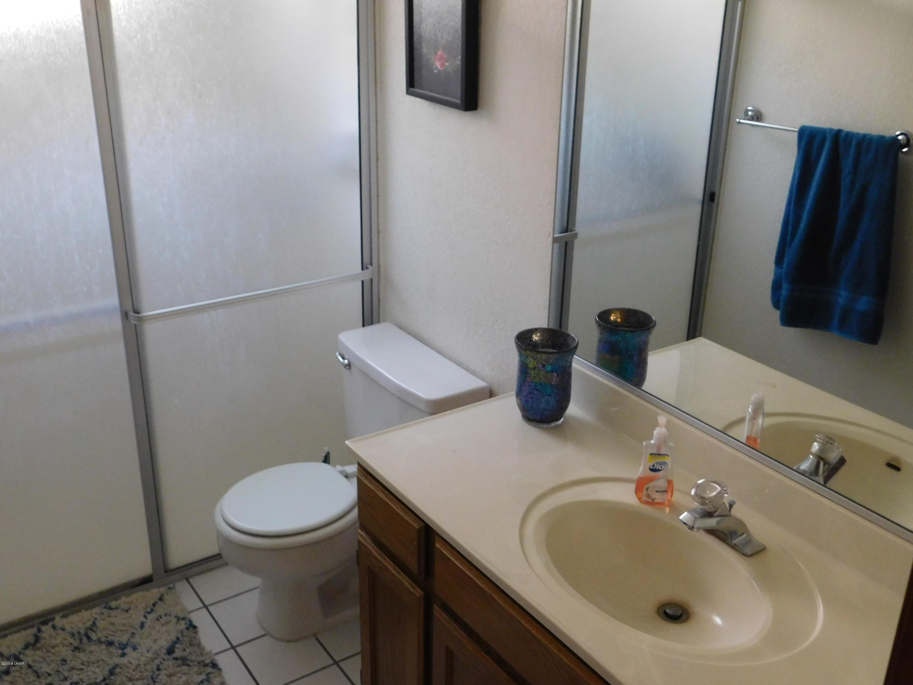 4010 Bluegrass Drive, Unit R Lake Havasu City, AZ 86406 - Photo 21 of 47 a bathroom with a sink and a toilet