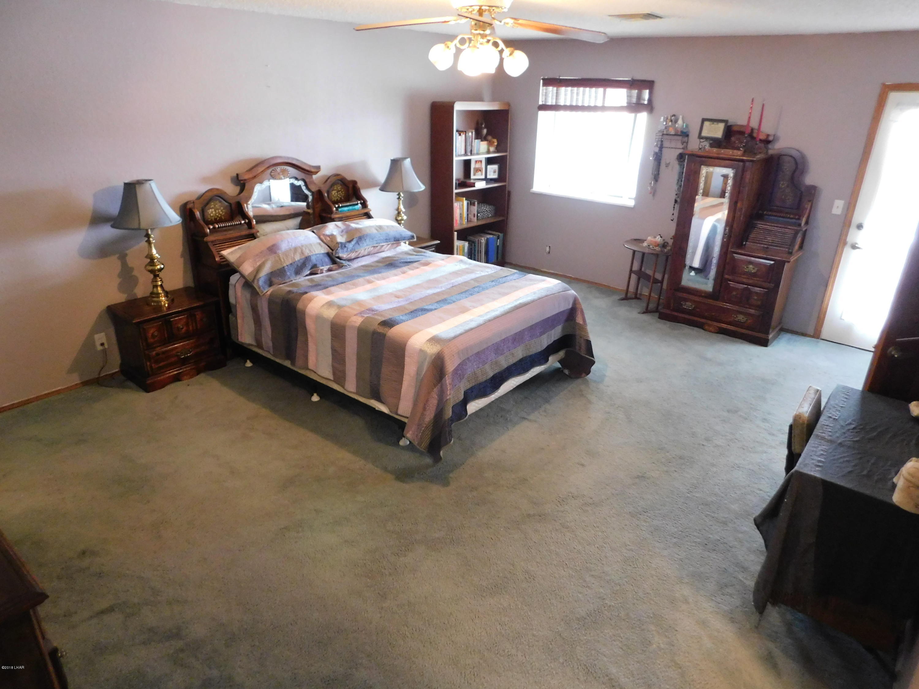 4010 Bluegrass Drive, Unit R Lake Havasu City, AZ 86406 - Photo 23 of 47 a bedroom with a bed and dresser