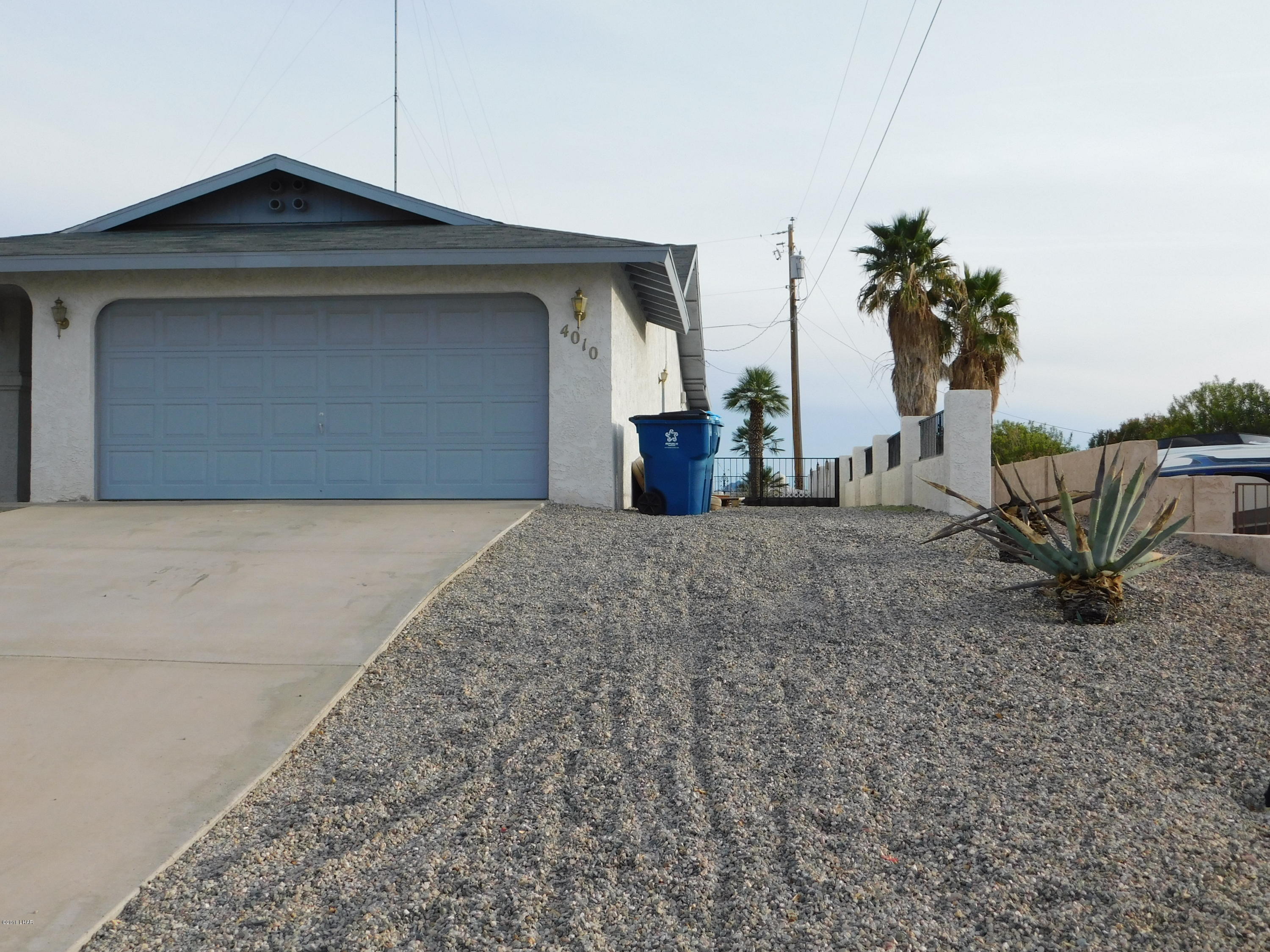4010 Bluegrass Drive, Unit R Lake Havasu City, AZ 86406 - Photo 3 of 47 a front view of a house with garden