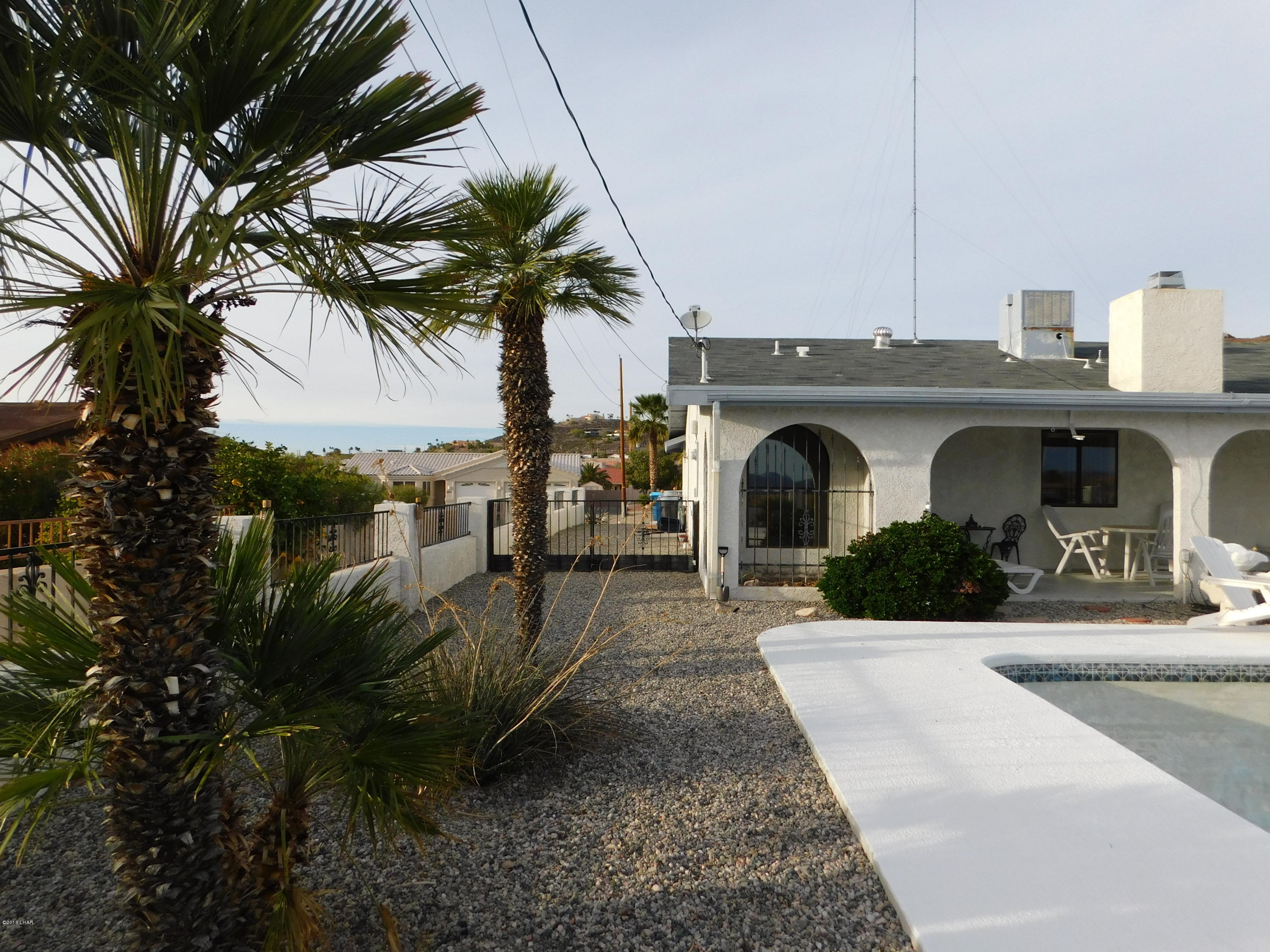 4010 Bluegrass Drive, Unit R Lake Havasu City, AZ 86406 - Photo 35 of 47 a view of a house with a patio