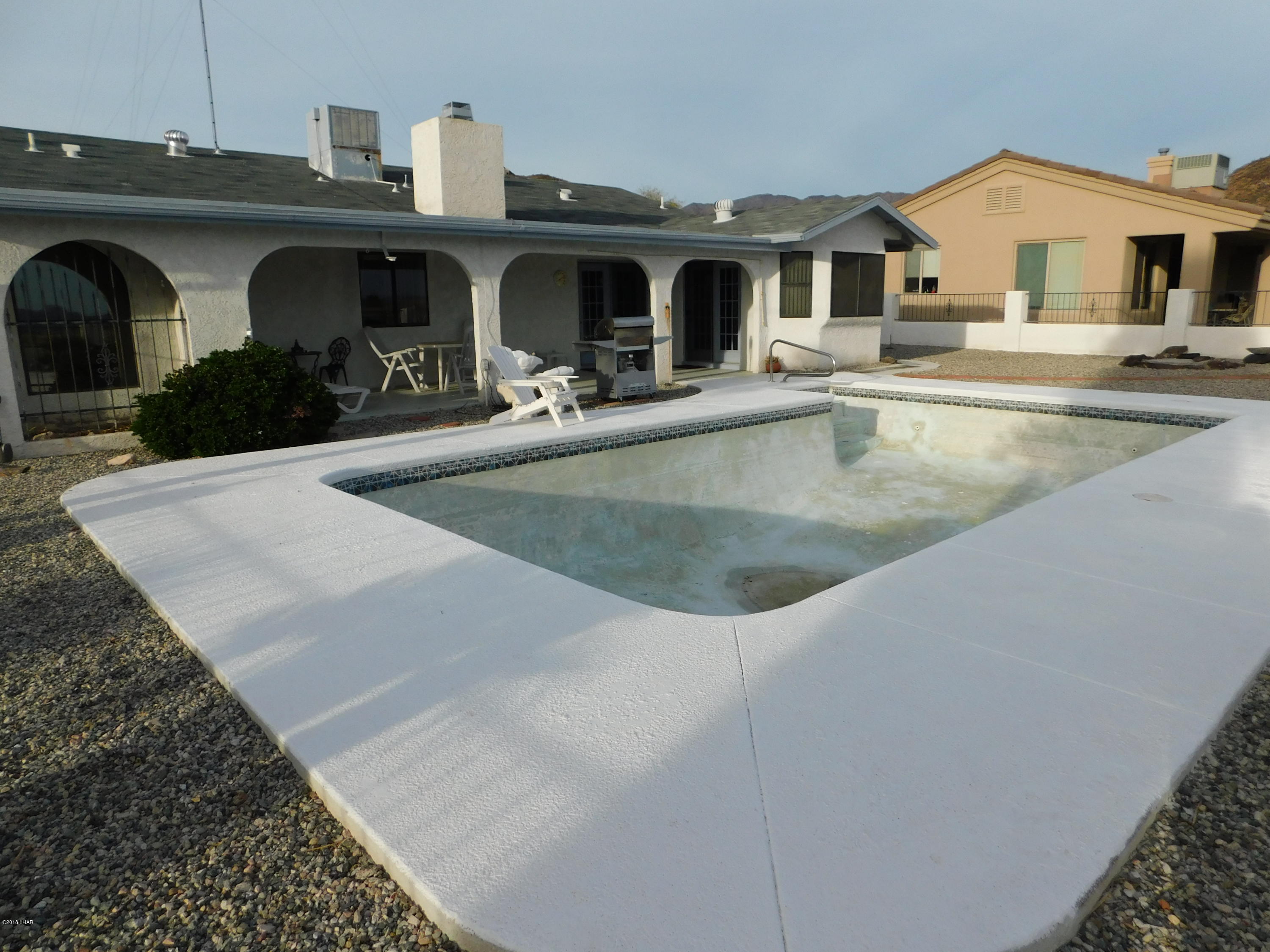4010 Bluegrass Drive, Unit R Lake Havasu City, AZ 86406 - Photo 36 of 47 a view of a house with cars park