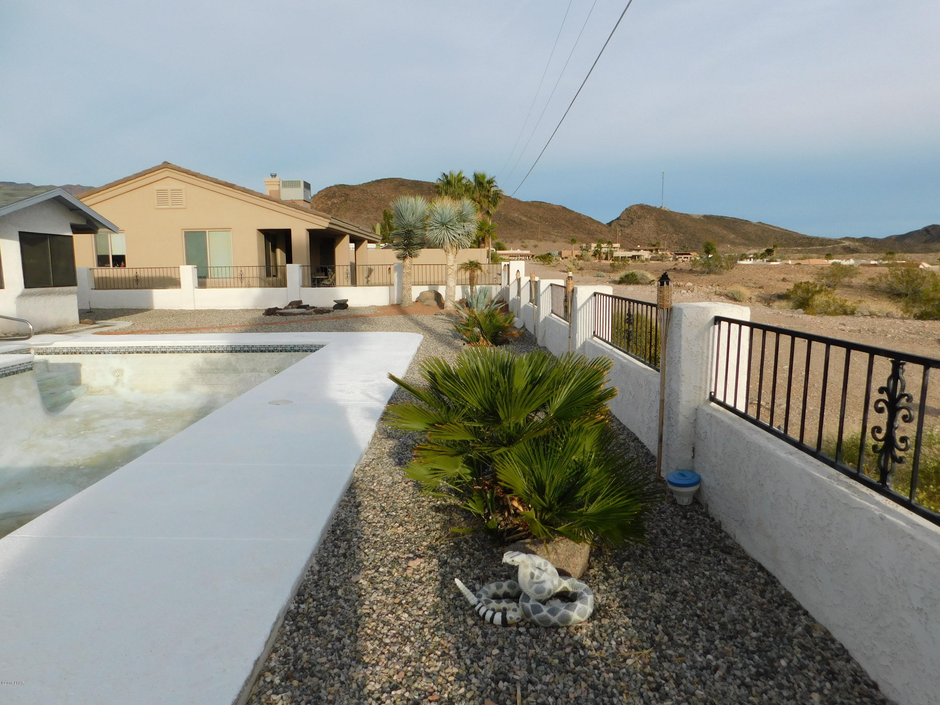 4010 Bluegrass Drive, Unit R Lake Havasu City, AZ 86406 - Photo 37 of 47 a view of a house with a yard