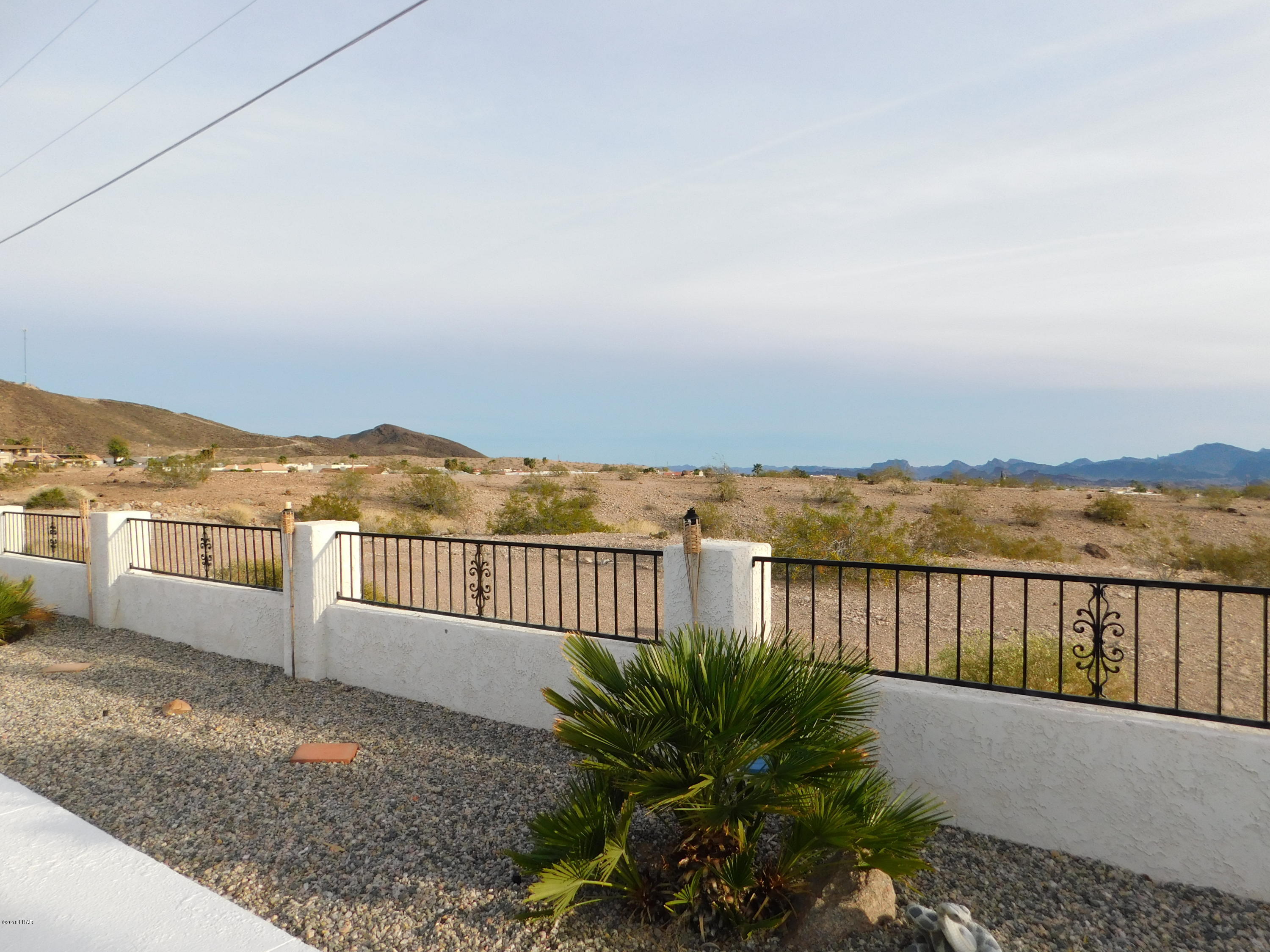 4010 Bluegrass Drive, Unit R Lake Havasu City, AZ 86406 - Photo 38 of 47 a view of a terrace with a lake view
