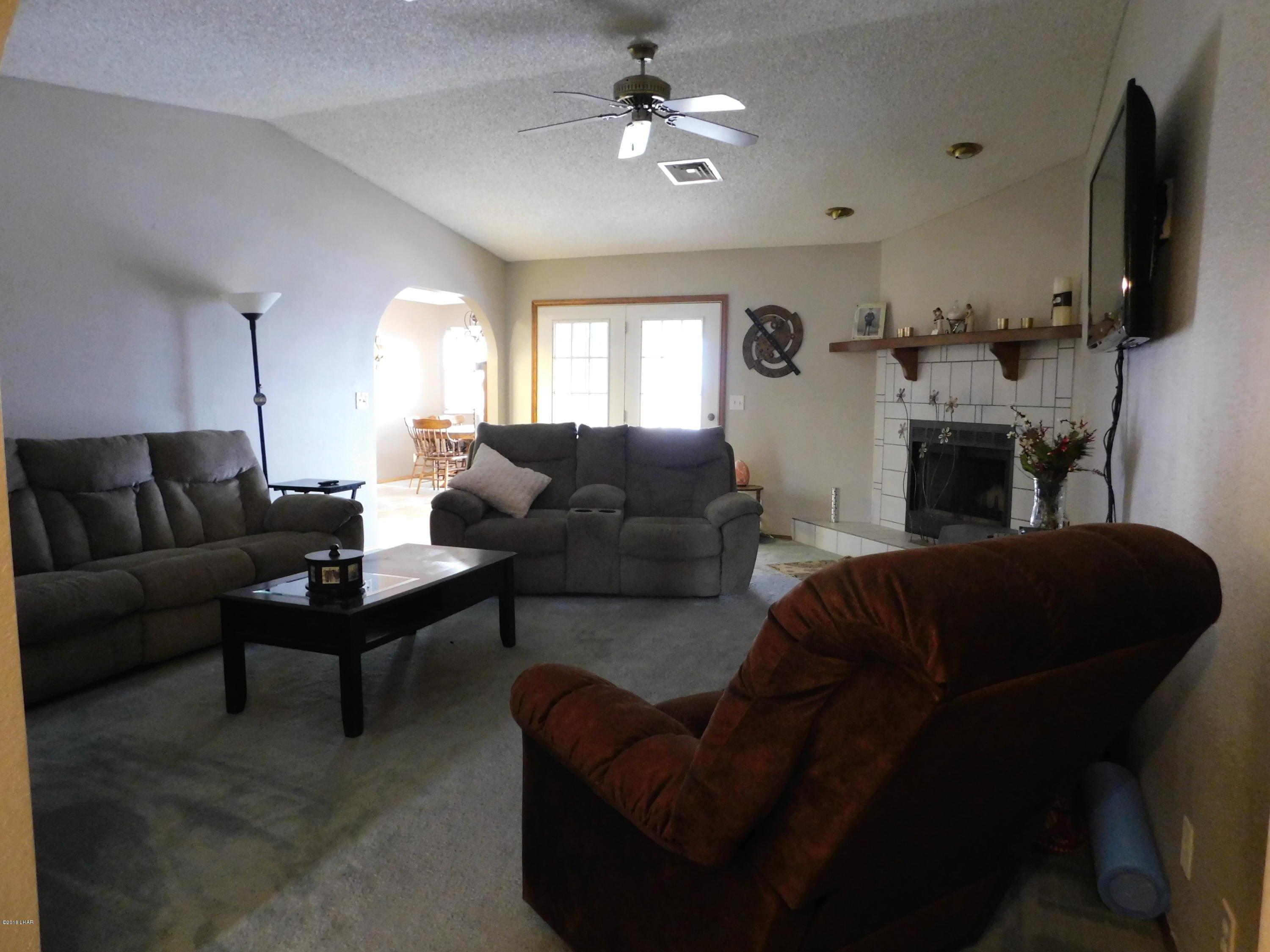 4010 Bluegrass Drive, Unit R Lake Havasu City, AZ 86406 - Photo 7 of 47 a living room with furniture and a flat screen tv