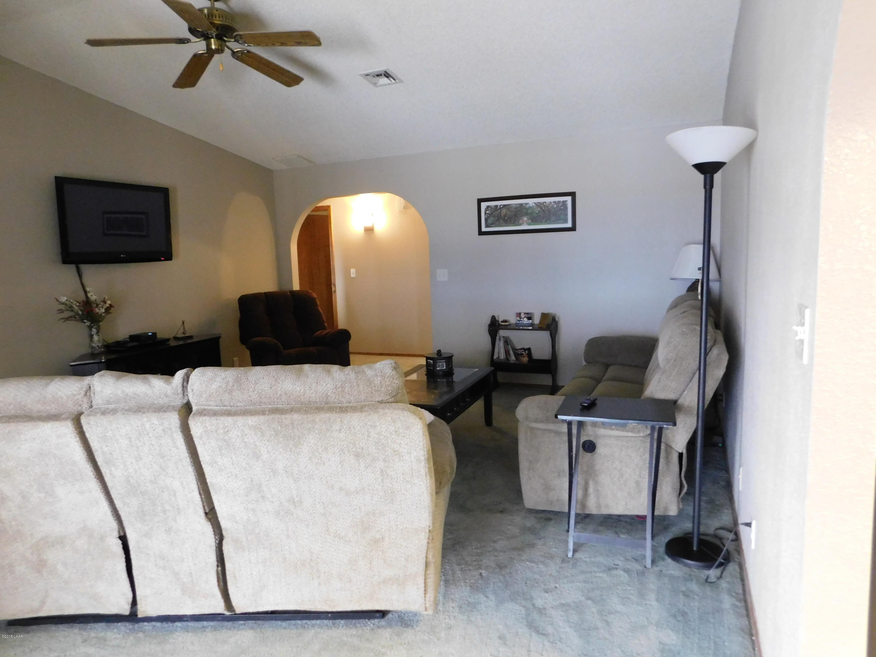 4010 Bluegrass Drive, Unit R Lake Havasu City, AZ 86406 - Photo 9 of 47 a living room with furniture and a flat screen tv