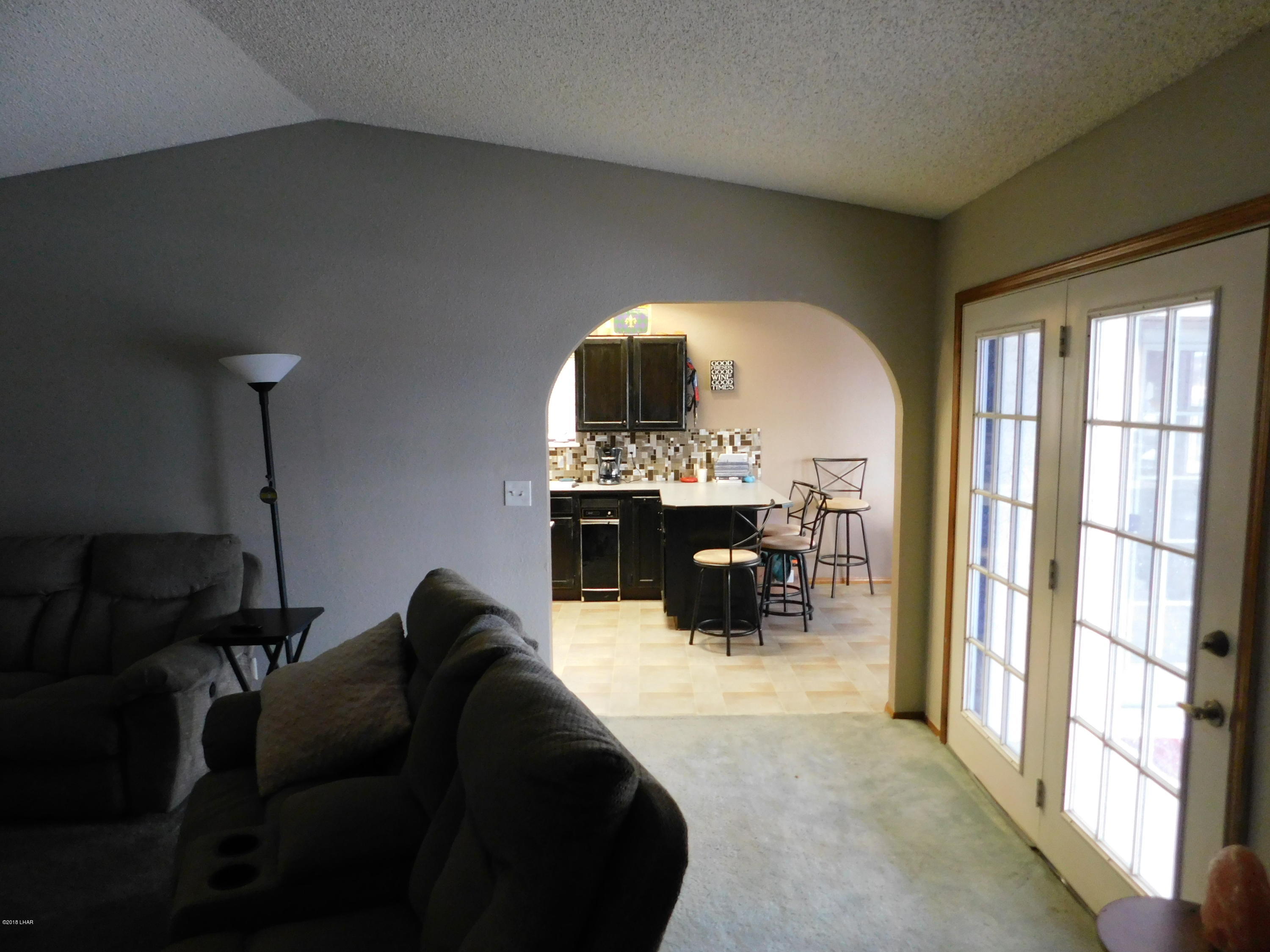4010 Bluegrass Drive, Unit R Lake Havasu City, AZ 86406 - Photo 10 of 47 a living room with furniture and a fireplace