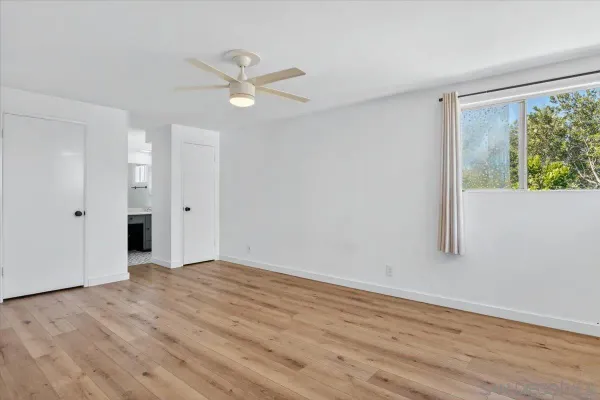 a view of a patio with table and chairs potted plants with wooden fence