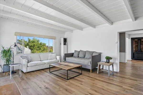 a kitchen with stainless steel appliances kitchen island granite countertop a refrigerator and a sink
