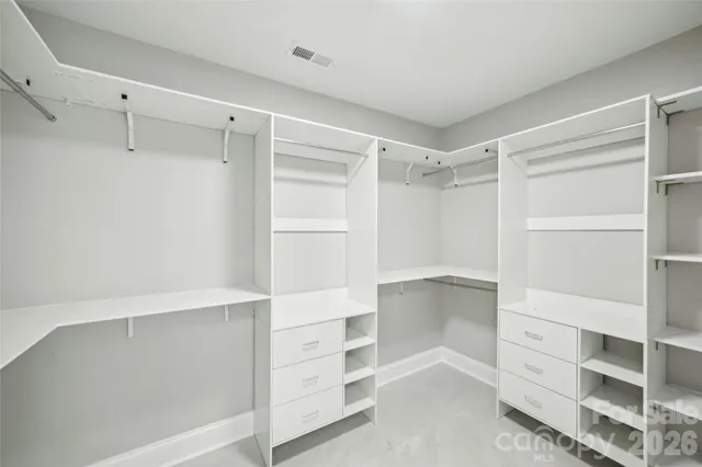 a view of an empty walk in closet