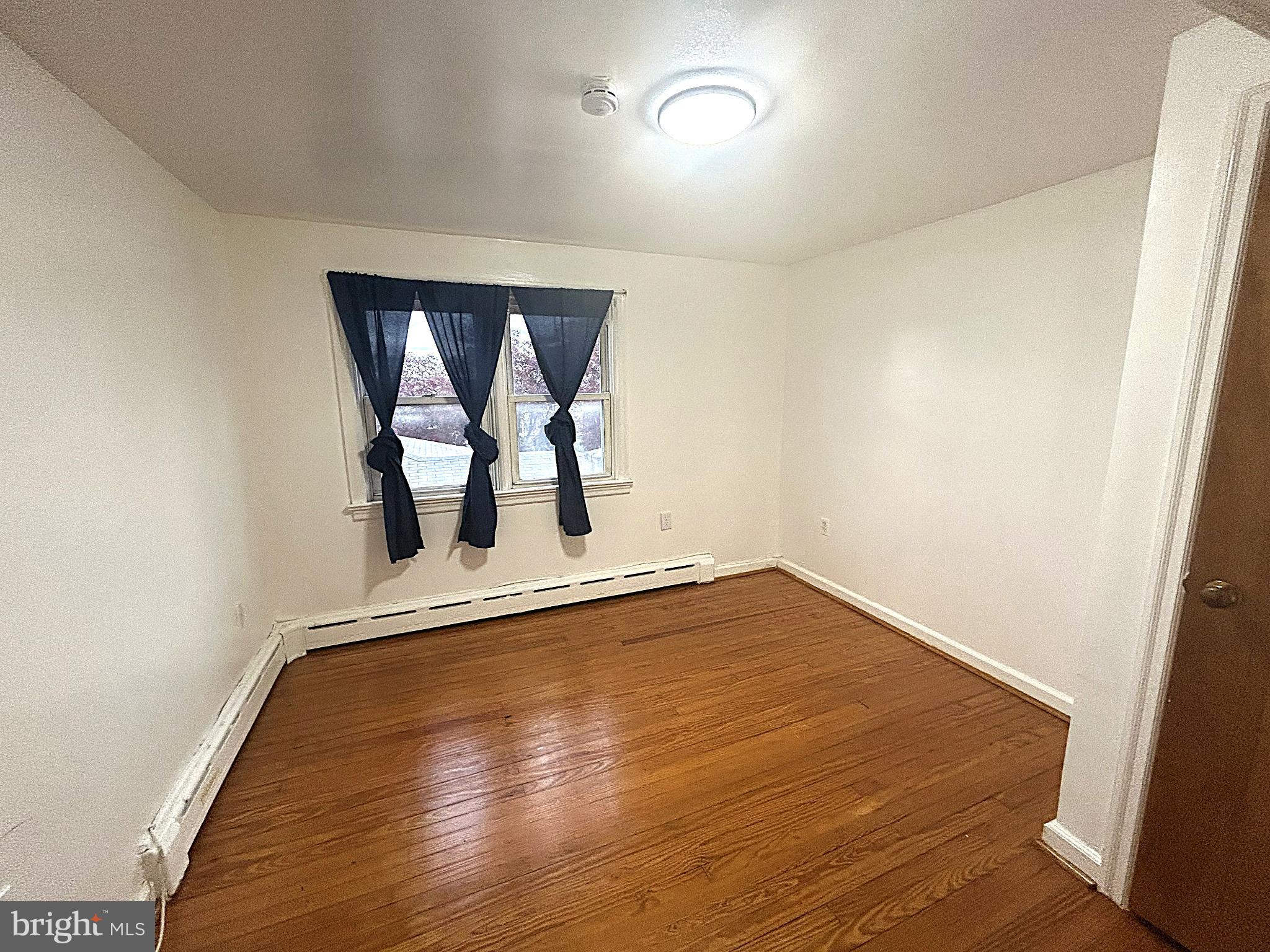 625 Grove Street Bridgeport, PA 19405 - Photo 12 of 15 a view of empty room with wooden floor