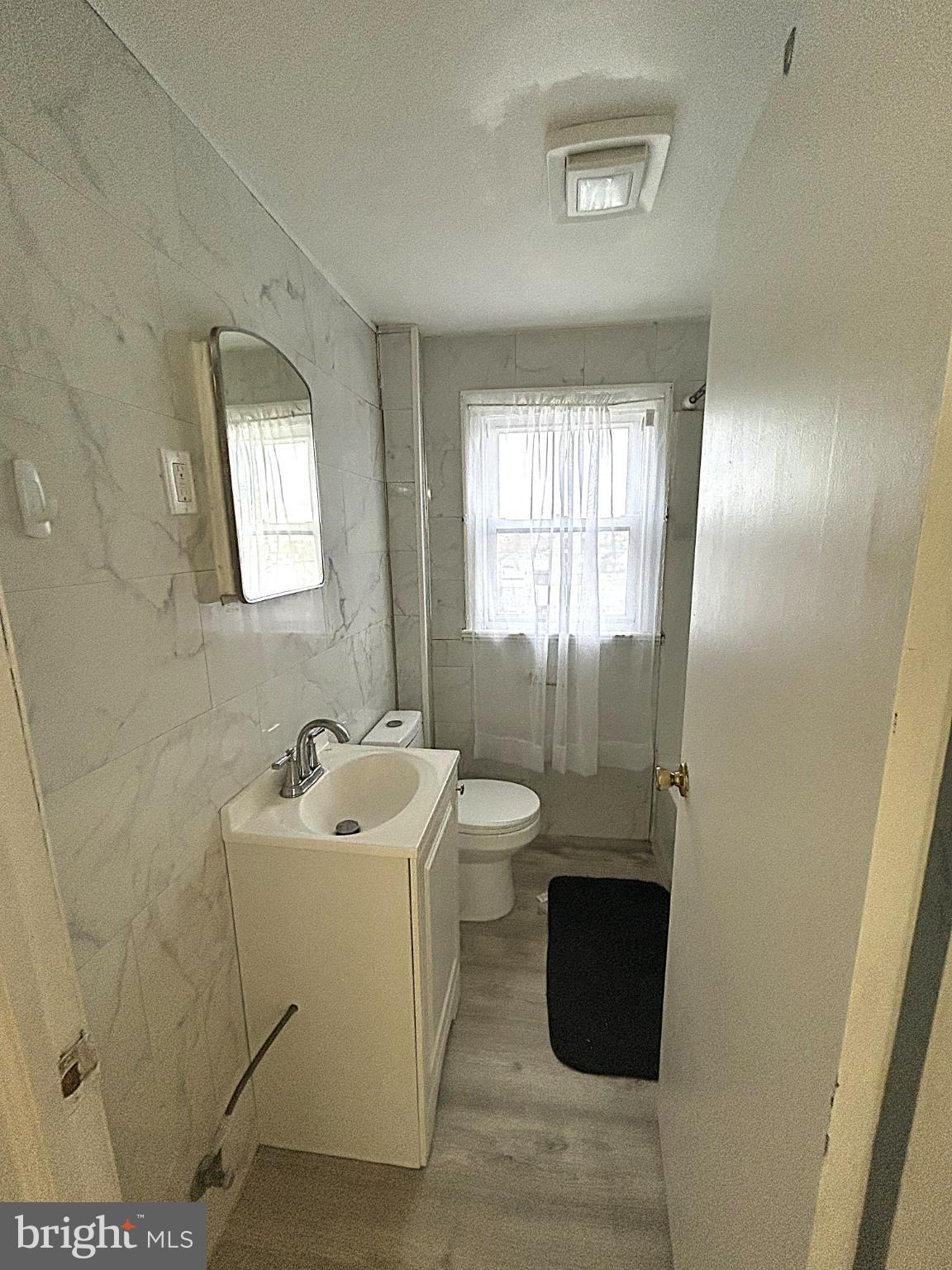 625 Grove Street Bridgeport, PA 19405 - Photo 14 of 15 a bathroom with a sink and a mirror