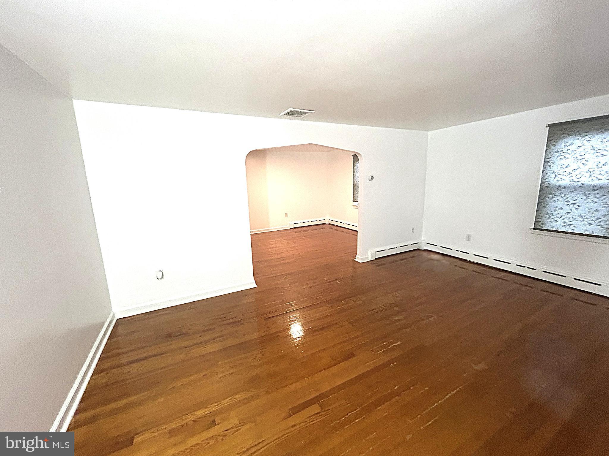 625 Grove Street Bridgeport, PA 19405 - Photo 5 of 15 a view of a room with wooden floor