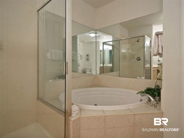 27284 Gulf Road, Unit 404 Orange Beach, AL 36561 - Photo 4 of 23 Master Bath has jetted tub & separate shower