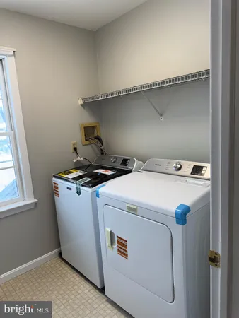 a utility room with washer and dryer
