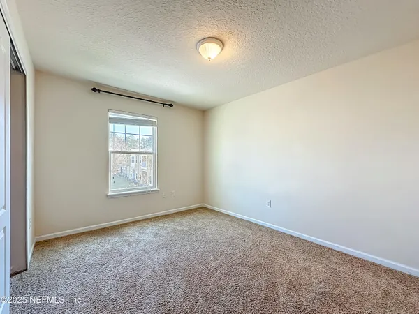 an empty room with windows and
