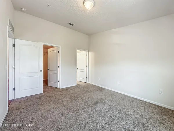 an empty room with an entryway