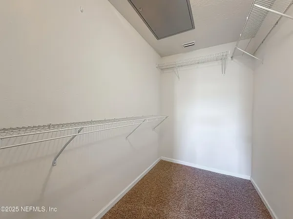 a view of a room with racks on the wall