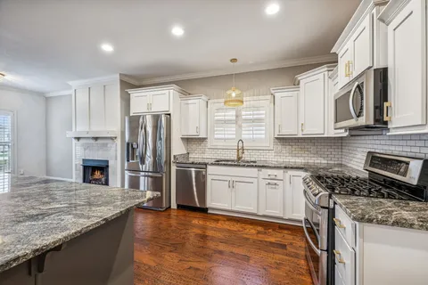 a view of kitchen with furniture and window