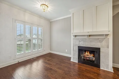a view of an empty room with a ceiling fan