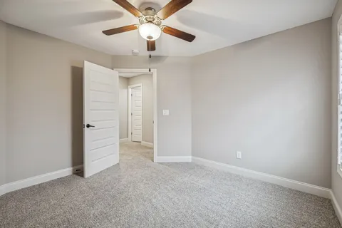 an aerial view of a residential houses with outdoor space and garden
